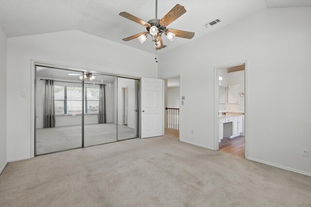 1800 Chatham Dr, Flower Mound, TX 75028 - unfurnished bedroom with vaulted ceiling, light carpet, a ceiling fan, a closet, and ensuite bathroom