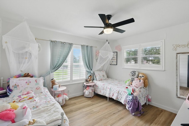 600 Reese Ln, Azle, TX 76020 - bedroom with wood finished floors and ceiling fan