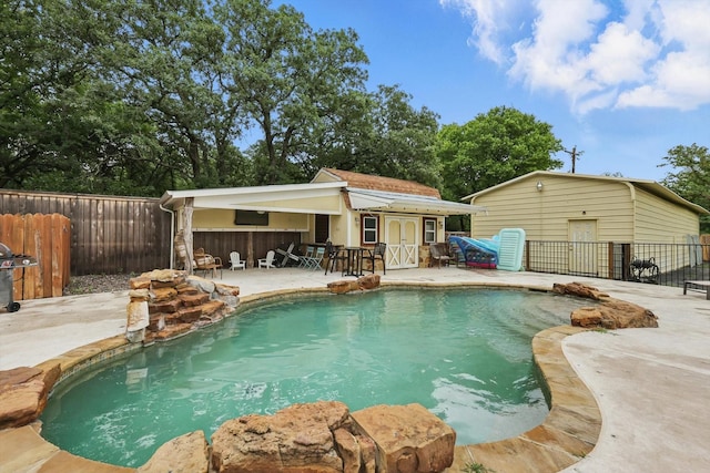 600 Reese Ln, Azle, TX 76020 - view of pool featuring a patio, an outbuilding, and a storage structure