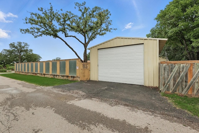600 Reese Ln, Azle, TX 76020 - detached garage featuring driveway and a gate
