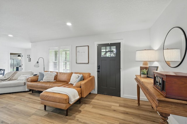 600 Reese Ln, Azle, TX 76020 - living area featuring light wood finished floors, recessed lighting, and a textured ceiling