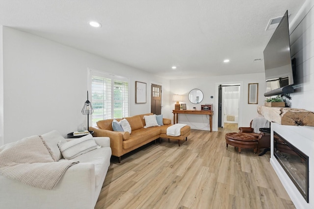 600 Reese Ln, Azle, TX 76020 - living room featuring light wood-style floors and recessed lighting
