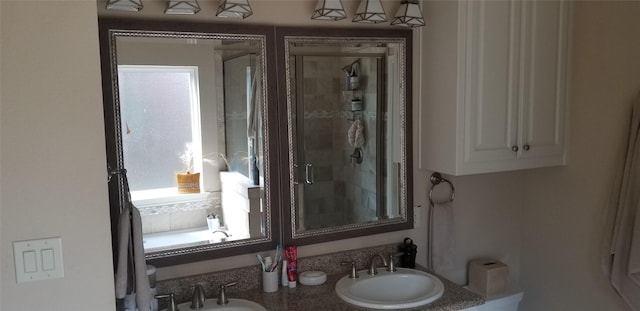 3428 Red Bird Ln, Grapevine, TX 76051 - bathroom featuring a stall shower and double vanity