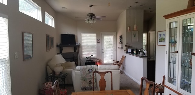 3428 Red Bird Ln, Grapevine, TX 76051 - carpeted dining space featuring ceiling fan and a high ceiling
