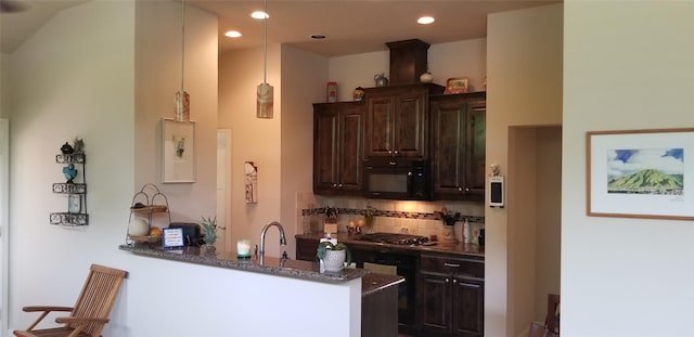 3428 Red Bird Ln, Grapevine, TX 76051 - kitchen with black microwave, dark brown cabinets, gas cooktop, backsplash, and dark stone countertops