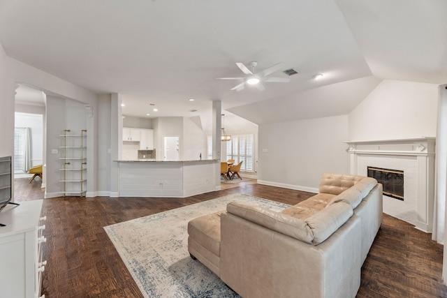 2600 Shiloh Rd, Denton, TX 76210 - living area featuring a ceiling fan, dark wood-type flooring, a glass covered fireplace, vaulted ceiling, and recessed lighting