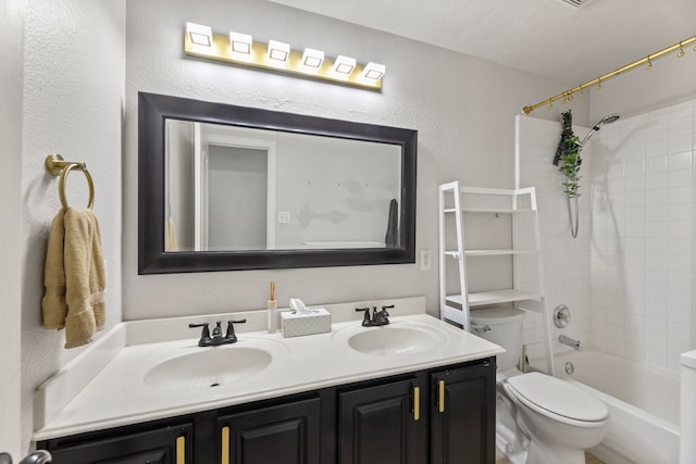 2600 Shiloh Rd, Denton, TX 76210 - full bath with double vanity, shower / tub combination, and a textured wall