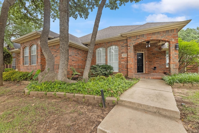 2600 Shiloh Rd, Denton, TX 76210 - view of front of home featuring brick siding, roof with shingles, and covered porch