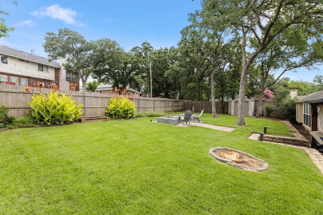 2600 Shiloh Rd, Denton, TX 76210 - fenced backyard featuring an outdoor fire pit, a shed, and a patio