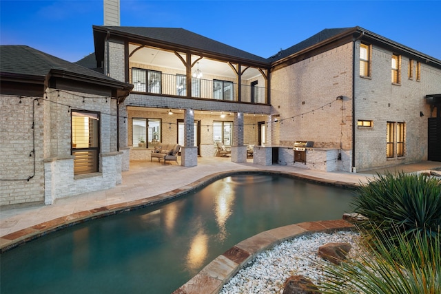 5302 Westfield Dr, Parker, TX 75002 - back of property with a balcony, area for grilling, an outdoor living space, a patio area, and brick siding