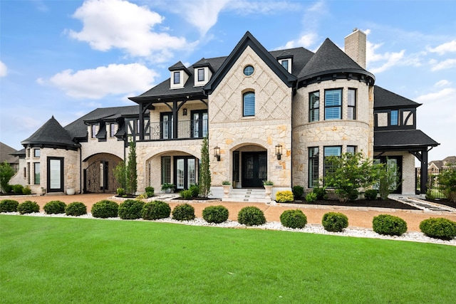 5302 Westfield Dr, Parker, TX 75002 - french provincial home featuring a balcony, stone siding, a front yard, and a chimney