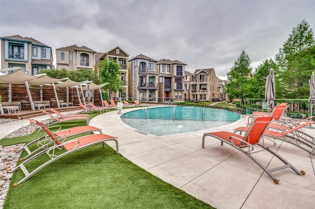 8203 Laflin Ln, Dallas, TX 75231 - community pool featuring a residential view and a lawn