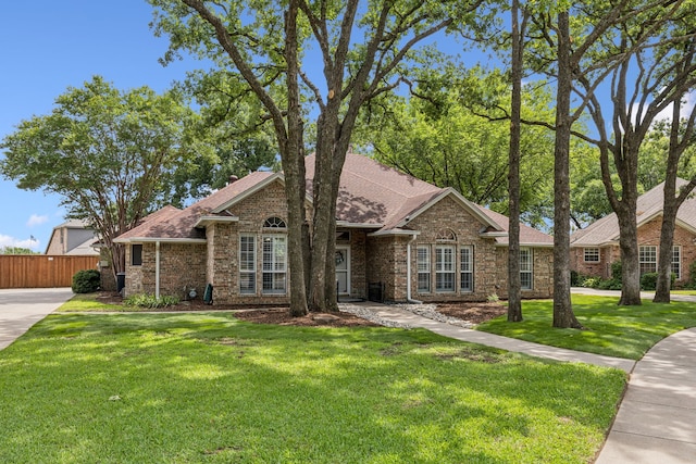 3108 Deerfield Dr, Denton, TX 76208 - view of front facade featuring brick siding and a shingled roof