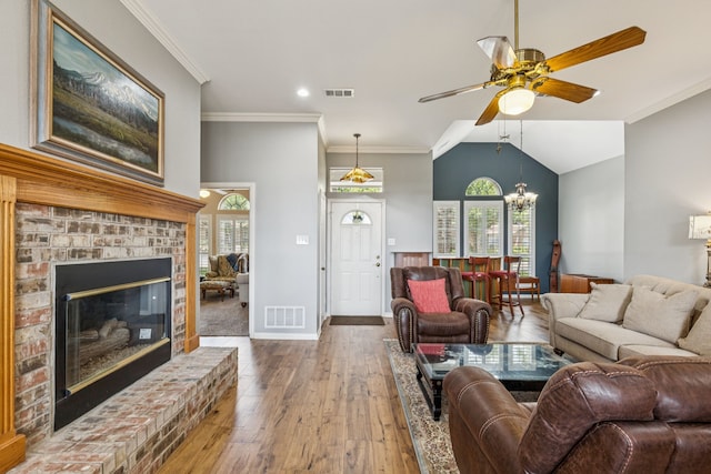 3108 Deerfield Dr, Denton, TX 76208 - living room featuring hardwood / wood-style flooring, ceiling fan, plenty of natural light, a brick fireplace, and lofted ceiling