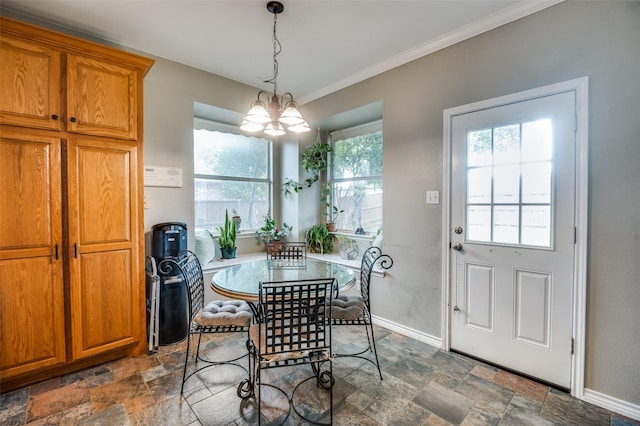 3209 Windridge Ln, Corinth, TX 76208 - dining space featuring stone finish floors, a chandelier, and crown molding