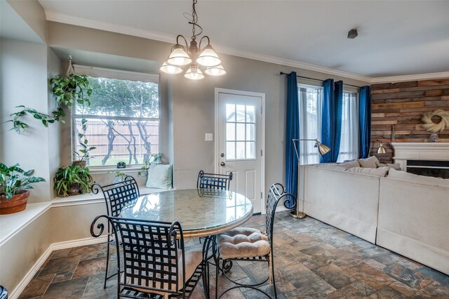 3209 Windridge Ln, Corinth, TX 76208 - dining room with stone tile flooring, crown molding, and a fireplace
