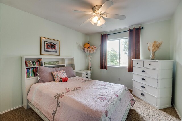 3209 Windridge Ln, Corinth, TX 76208 - carpeted bedroom with baseboards and a ceiling fan