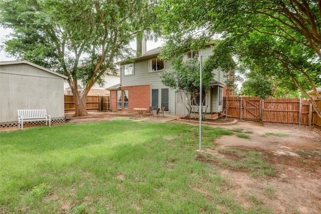 3209 Windridge Ln, Corinth, TX 76208 - fenced backyard featuring a gate and a patio area