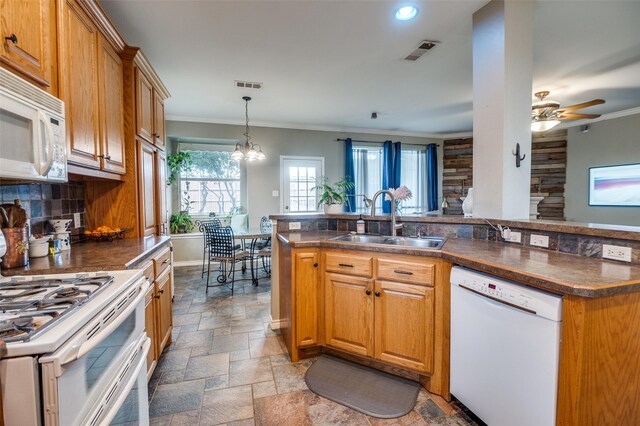 3209 Windridge Ln, Corinth, TX 76208 - kitchen with white appliances, dark countertops, ornamental molding, stone tile floors, and decorative backsplash