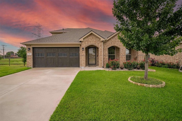 9200 S Field Ln, Arlington, TX 76002 - view of front of house featuring an attached garage, driveway, a yard, and a shingled roof
