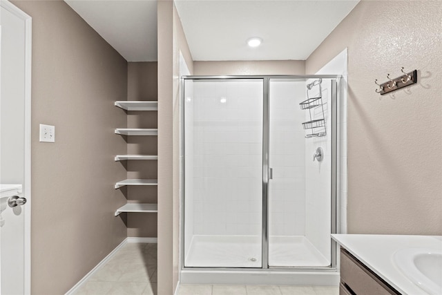 2300 Torch Lake Dr, Forney, TX 75126 - bathroom with a shower stall, vanity, and tile patterned floors