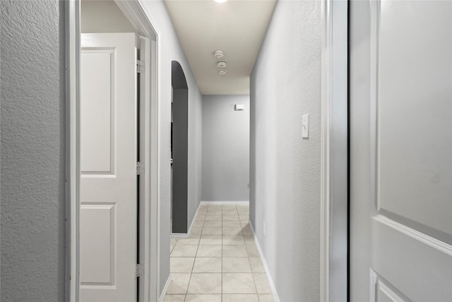2300 Torch Lake Dr, Forney, TX 75126 - hallway with light tile patterned floors and a textured wall