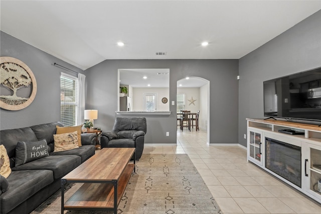 2300 Torch Lake Dr, Forney, TX 75126 - living area with arched walkways, light tile patterned flooring, recessed lighting, and vaulted ceiling