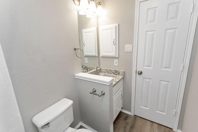 1449 Saint Gallen Ln, Lewisville, TX 75067 - half bathroom with vanity and wood finished floors