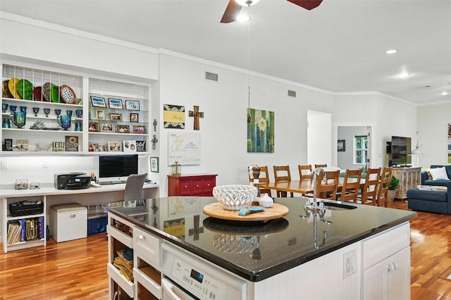 2116 Darby Dan Ct, Granbury, TX 76049 - kitchen featuring crown molding, a ceiling fan, light wood finished floors, white cabinets, and recessed lighting