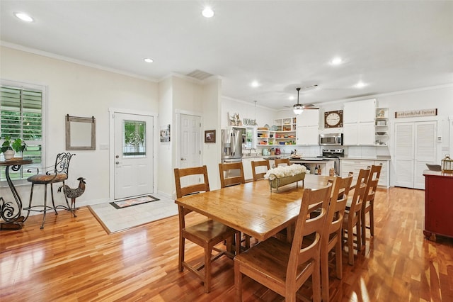 2116 Darby Dan Ct, Granbury, TX 76049 - dining area with crown molding, light wood-style flooring, recessed lighting, and a ceiling fan