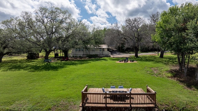 5986 Field Ct, Granbury, TX 76048 - view of green lawn featuring a wooden deck and outdoor dining space