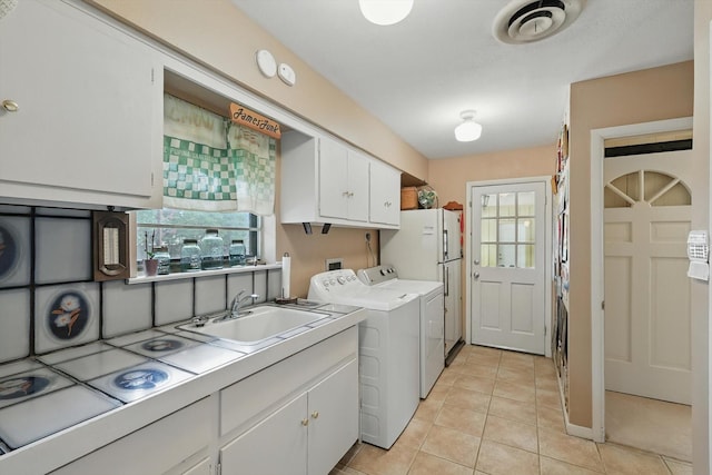 1615 Lopo Rd, Flower Mound, TX 75028 - laundry room with light tile patterned floors and separate washer and dryer