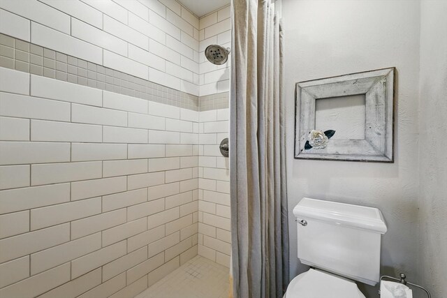 1615 Lopo Rd, Flower Mound, TX 75028 - full bathroom with a stall shower and toilet