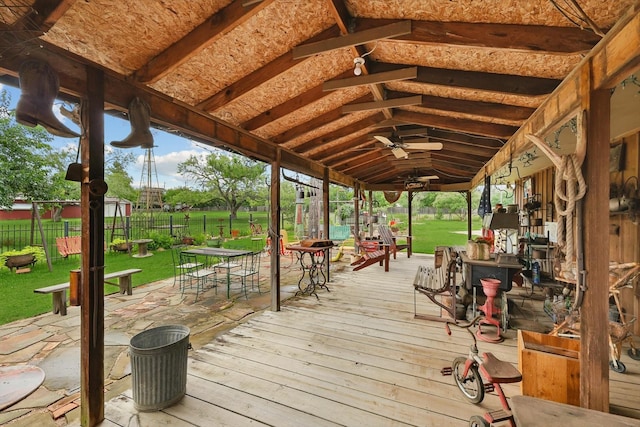 1615 Lopo Rd, Flower Mound, TX 75028 - deck featuring outdoor dining area, a fenced backyard, and a ceiling fan
