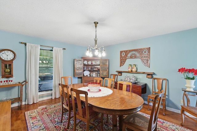 1615 Lopo Rd, Flower Mound, TX 75028 - dining area featuring wood finished floors and a chandelier
