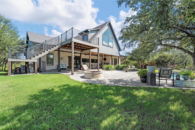 8029 N River Xing, China Spring, TX 76633 - back of property featuring a fire pit, stairway, a patio, a wooden deck, and a lawn