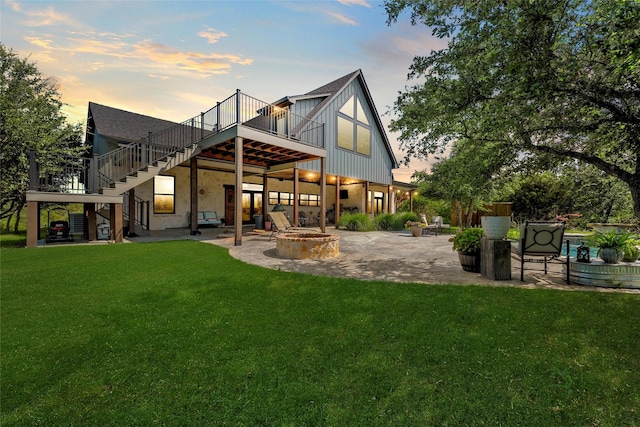 8029 N River Xing, China Spring, TX 76633 - rear view of house featuring an outdoor fire pit, stairs, a deck, a patio, and a yard