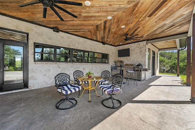 8029 N River Xing, China Spring, TX 76633 - view of patio / terrace featuring ceiling fan, an outdoor kitchen, and outdoor dining area