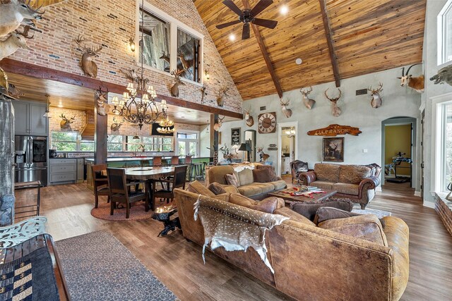 8029 N River Xing, China Spring, TX 76633 - living area featuring high vaulted ceiling, a wooden ceiling with exposed beams, wood finished floors, ceiling fan, and healthy amount of natural light