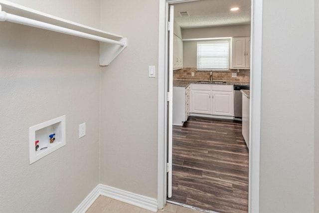 6908 Briardale Dr, North Richland Hills, TX 76182 - washroom with washer hookup and baseboards