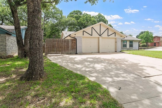 6908 Briardale Dr, North Richland Hills, TX 76182 - view of front of house with concrete driveway, a garage, and brick siding