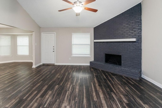 6908 Briardale Dr, North Richland Hills, TX 76182 - unfurnished living room with vaulted ceiling, wood finished floors, a ceiling fan, and a fireplace
