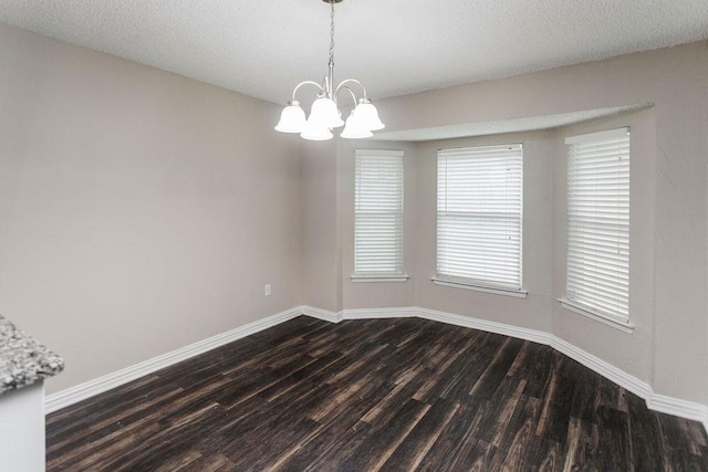 6908 Briardale Dr, North Richland Hills, TX 76182 - unfurnished room featuring dark wood-type flooring and a chandelier