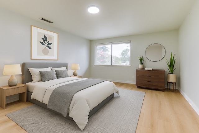 2018 Vail Dr, Garland, TX 75044 - bedroom with light wood-style flooring and baseboards