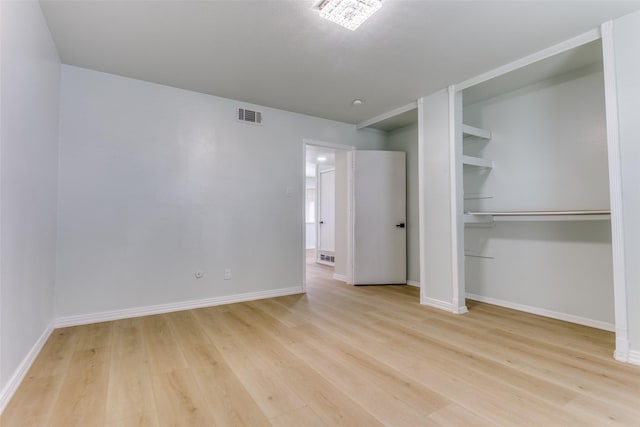 2018 Vail Dr, Garland, TX 75044 - unfurnished bedroom with light wood-style flooring and a closet