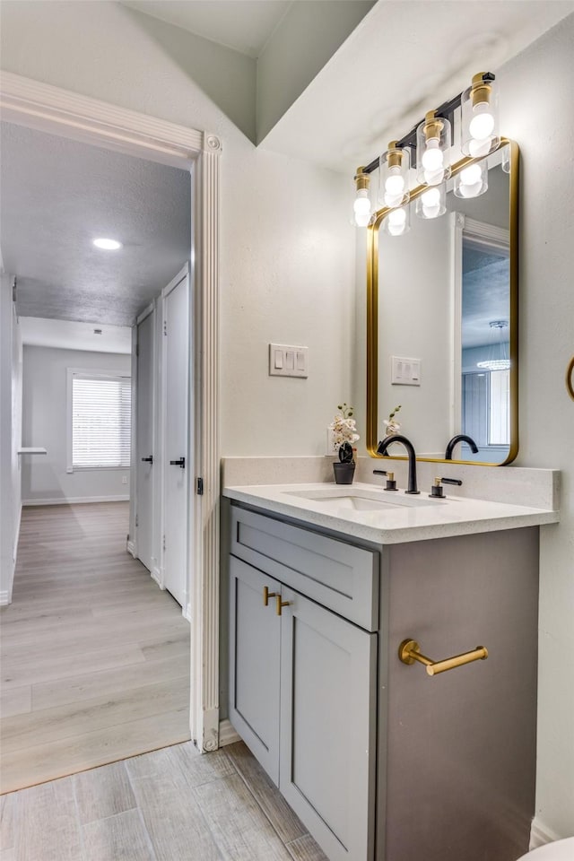 2018 Vail Dr, Garland, TX 75044 - bathroom with vanity and wood finished floors