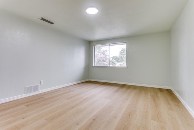 2018 Vail Dr, Garland, TX 75044 - unfurnished room with light wood-style flooring and baseboards