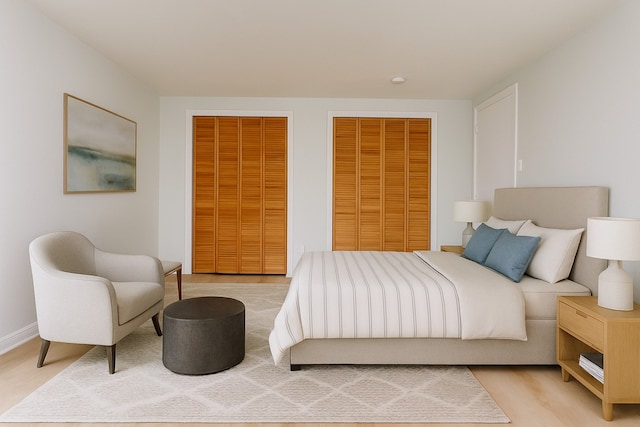 2018 Vail Dr, Garland, TX 75044 - bedroom featuring multiple closets and light wood finished floors