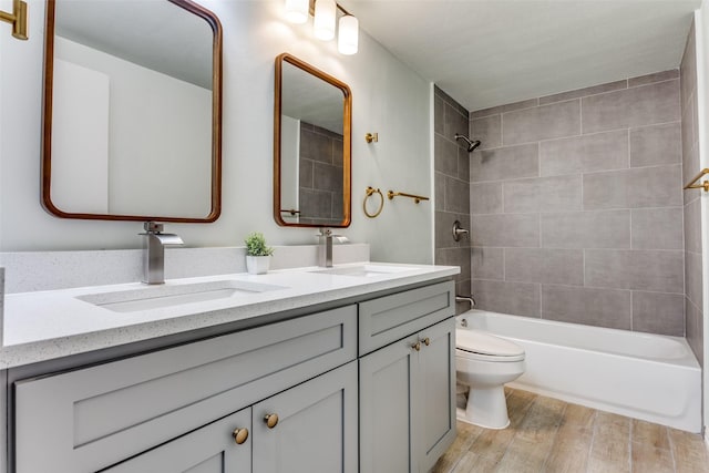 2018 Vail Dr, Garland, TX 75044 - full bath with double vanity, wood finished floors, and bathtub / shower combination