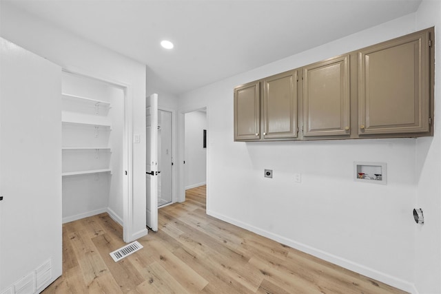 1813 Madera Dr, Waco, TX 76705 - laundry area featuring hookup for an electric dryer, hookup for a washing machine, light wood-style flooring, cabinet space, and recessed lighting